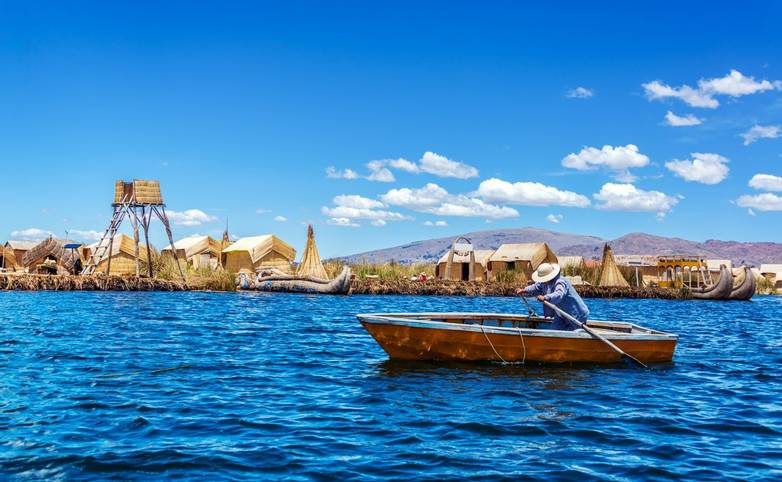 Rowboat at Uros floating islands on Lake Titicaca near Puno, Peru