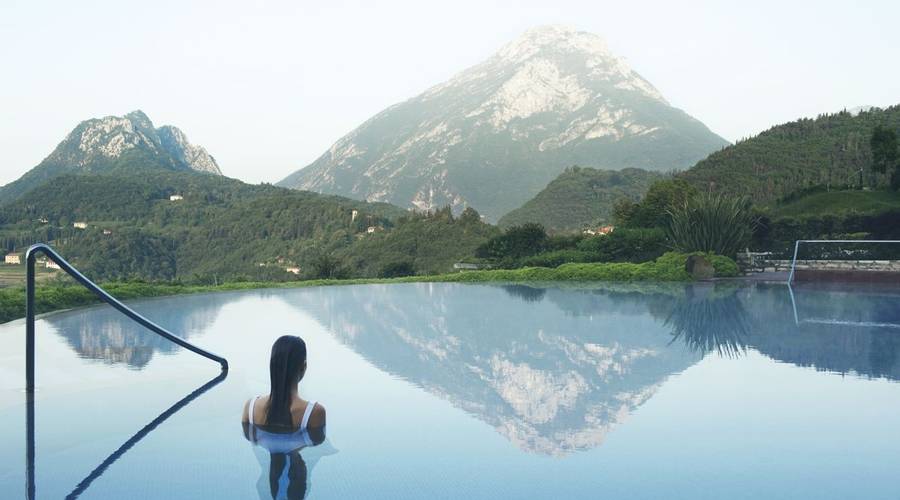 Woman in outdoor infinity pool at Lefay Resort & Spa, Italy