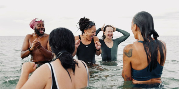 Woman in a red dress leading a salsa dance class