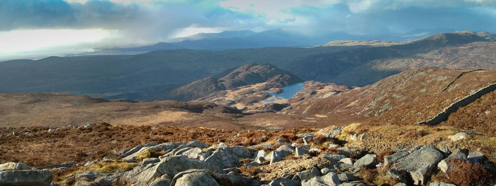 View North from Rhinog Fawr across mountains and lakes and taking in the estuary where the Afon Dwyryd river empties into th…