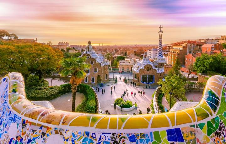 View of the city from Park Guell in Barcelona, Spain with moving clouds. View of the city from Park Guell in Barcelona, Spain with moving clouds.
