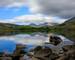 The summit of Snowdon with a cloud washing over it. The lake, Llynnau Mymbyr, Reflecting the scene. Snowdonia (Eryri), Wales…