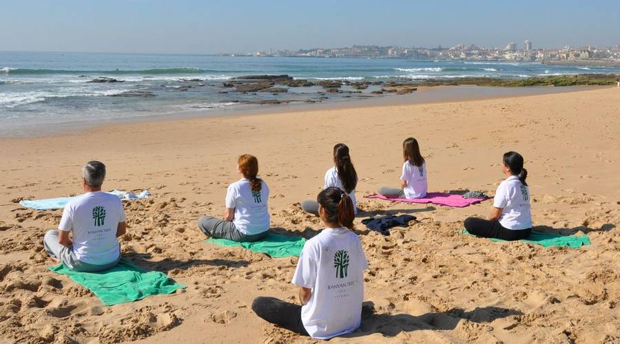 Beach yoga session at Palacio Estoril Golf and Spa Hotel in Portugal