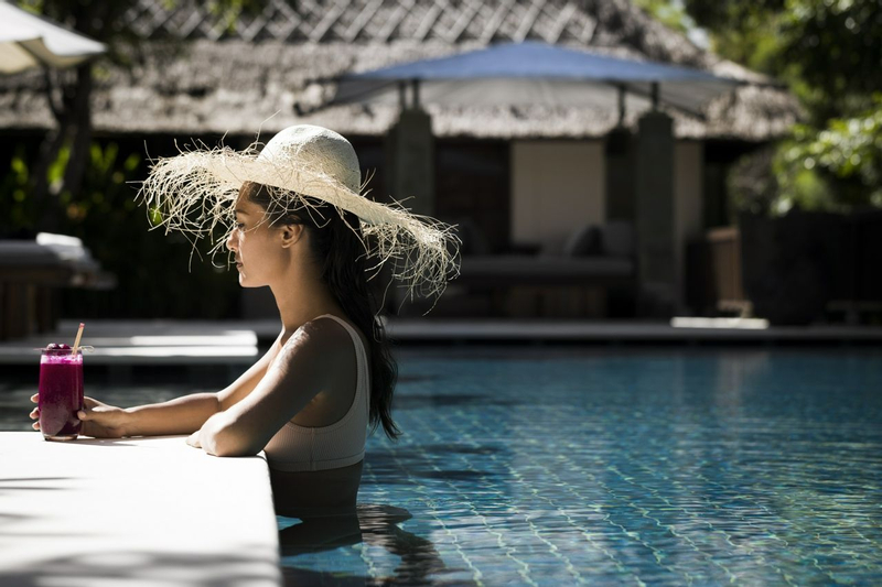 Woman in pool at a wellness resort