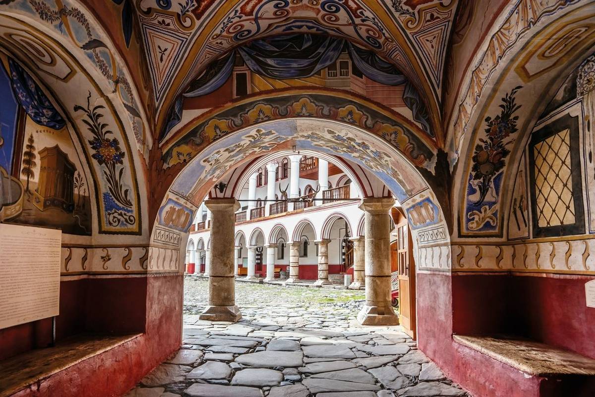 Samochov gate, the arch with painted vaults in the courtyard. Rila Monastery, or Monastery of Saint John of Rila, the most f…