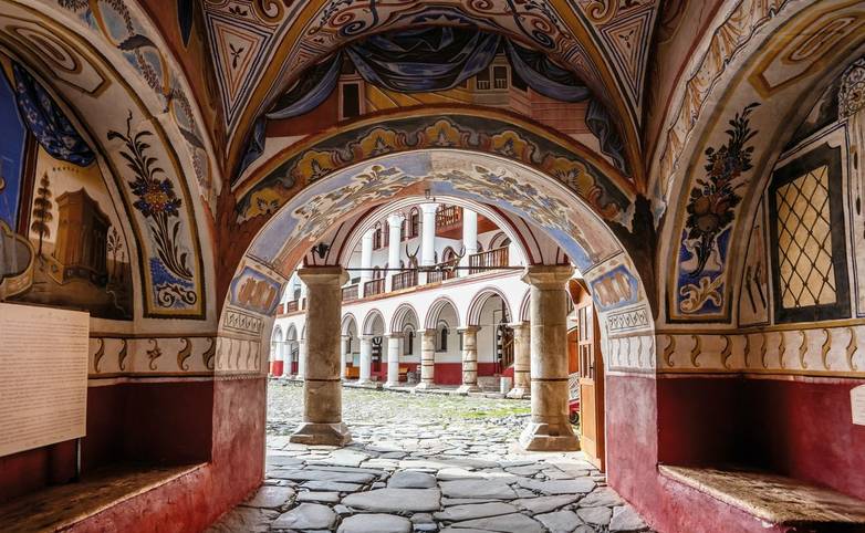 Samochov gate, the arch with painted vaults in the courtyard. Rila Monastery, or Monastery of Saint John of Rila, the most f…