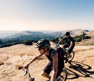 canyon ranch-woodside-california-couple mountain biking.jpg