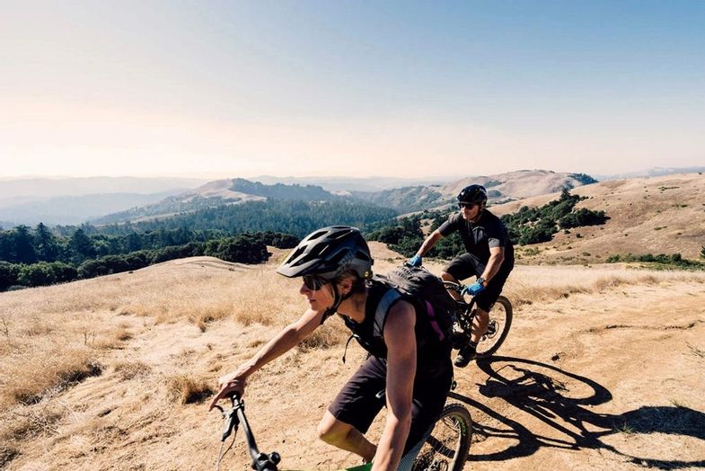 canyon ranch-woodside-california-couple mountain biking.jpg