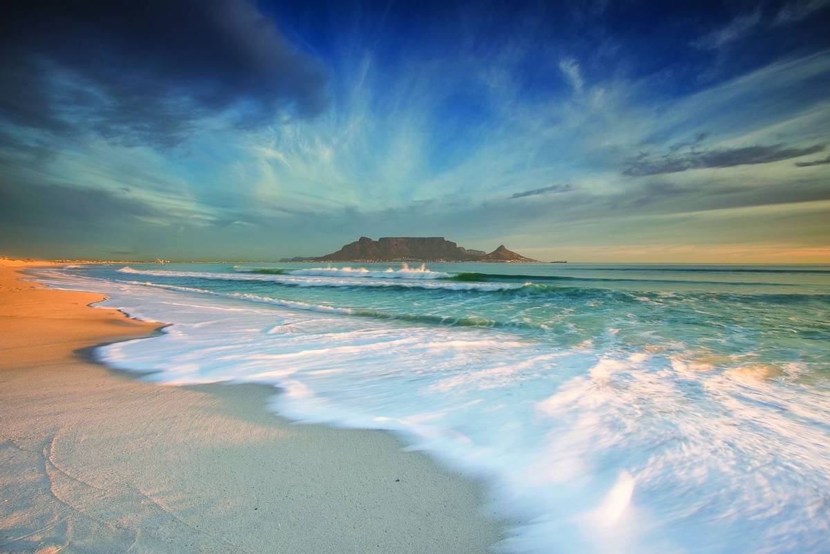 Beautiful wide angle landscape image of Table Mountain in Cape Town South Africa as seen from Blouberg beach