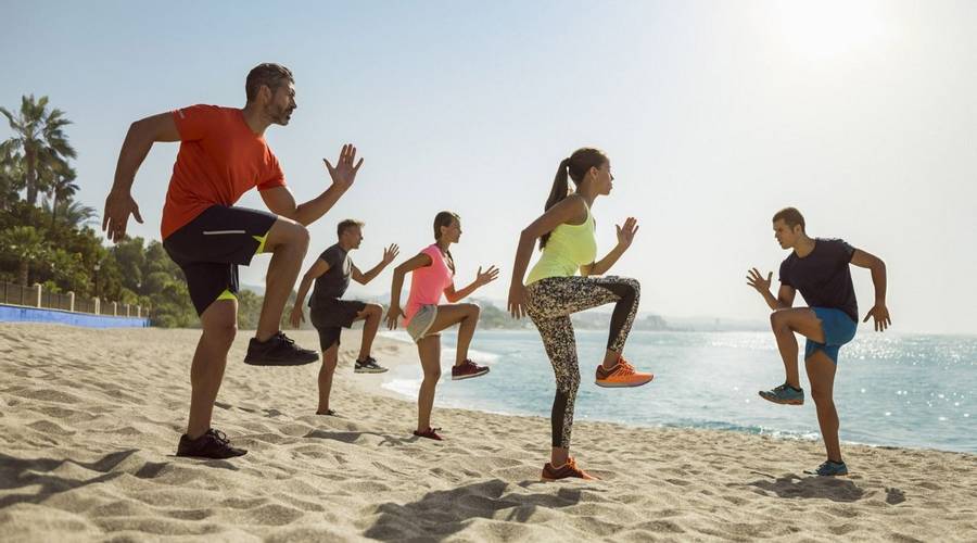 Group fitness class on the beach at Marbella Club