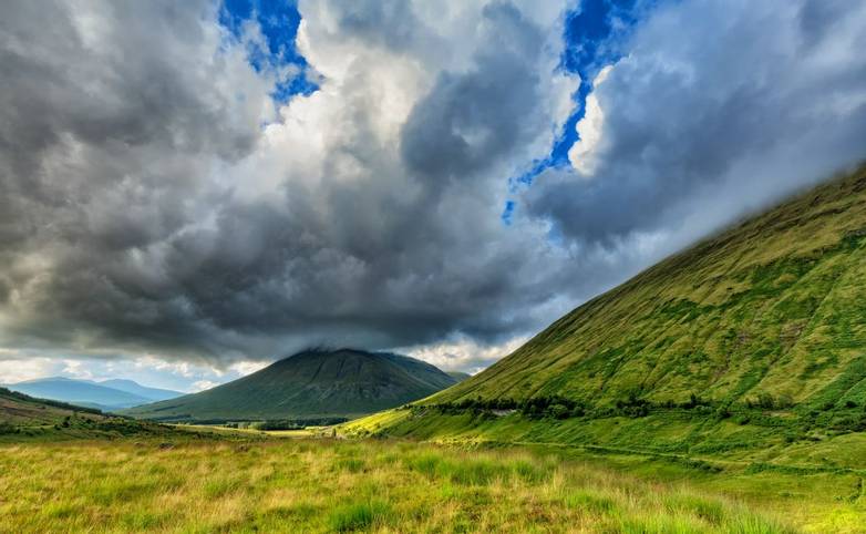 Dramatic Clouds over Beinn Dorain and Beinn Odhar Mountains in Scotland. 