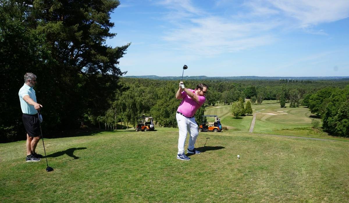 Golfer teeing off on 17th tee