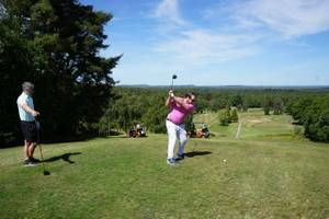Golfer teeing off on 17th tee