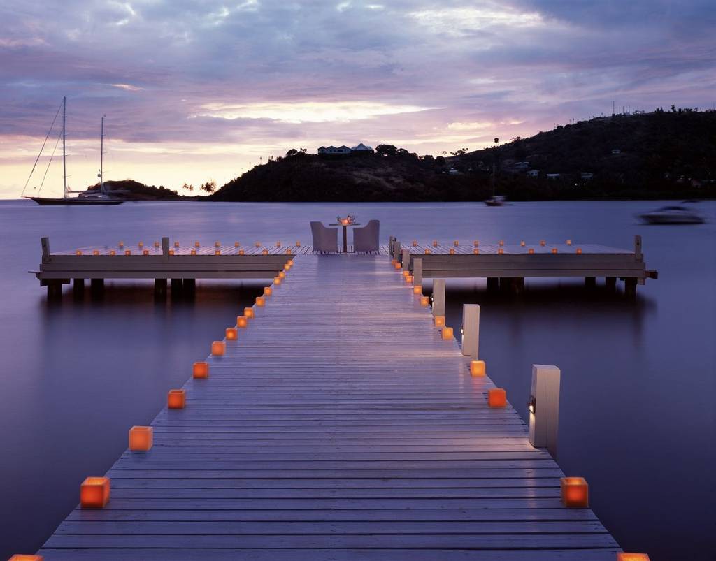 Candles on a promenade at Carlisle Bay in Antigua, the perfect wellness resort for Christmas and New Year