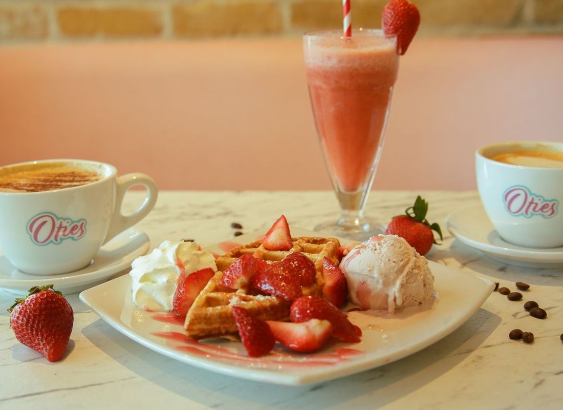 Strawberry waffles with ice cream and fresh strawberries