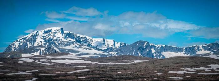 A view of Norway's Dovrefjell with snow mountains