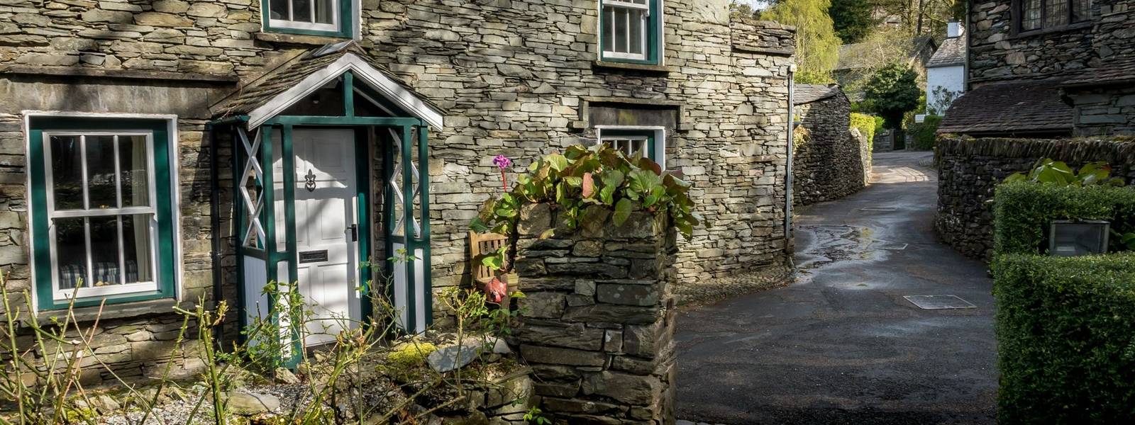 Traditional slate brick cottages in the rural English Lake District town of Grasmere known as the home of poet Willam Wordsw…