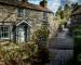 Traditional slate brick cottages in the rural English Lake District town of Grasmere known as the home of poet Willam Wordsw…