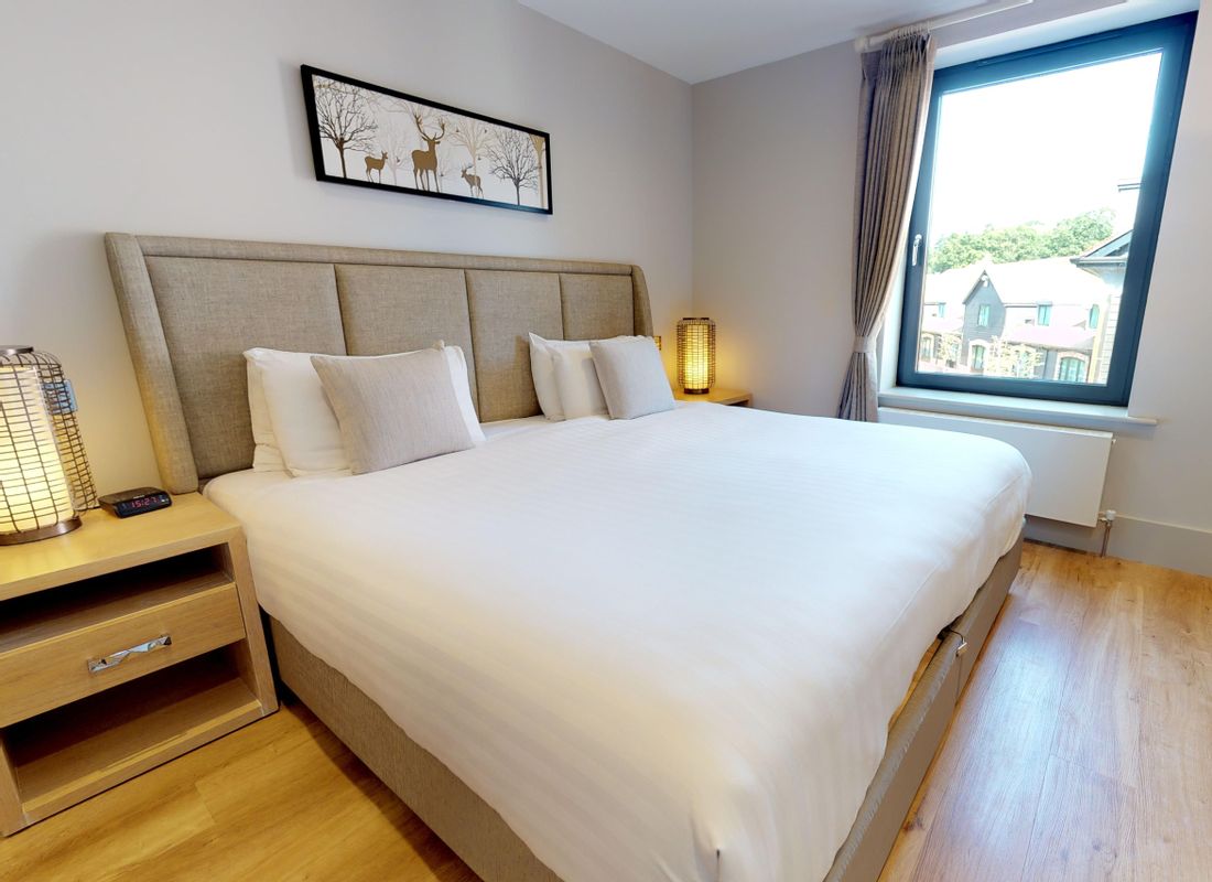 King size bed inside 2-bed self-catering apartment