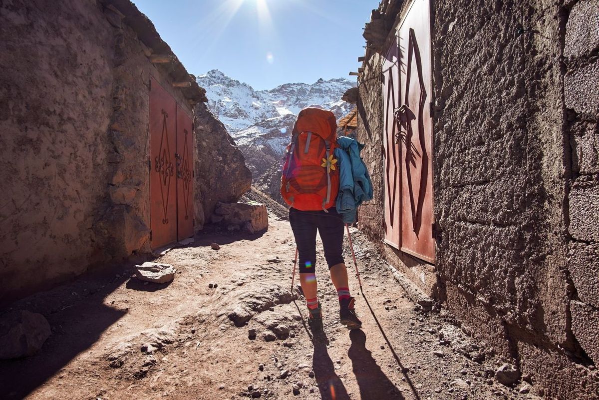 Tourist girl backpacker on the hike into the Atlas mountains in Morocco Africa