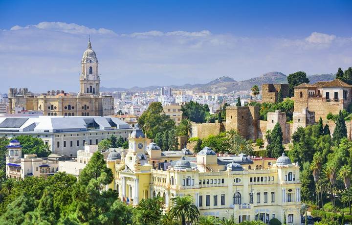 Malaga, Spain cityscape at the Cathedral, City Hall and Alcazaba citadel of Malaga. Malaga, Spain cityscape at the Cathedral, City Hall and Alcazaba citadel of Malaga.