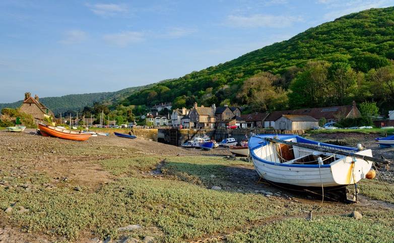 Boats on the shore at Porlock Weir, a pretty fishing villlage on the Exmoor coast in Somerset