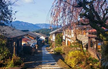 Magome juku post town of Nakasendo with cherry blossom or sakura in morning, Kiso valley in  Nakatsugawa, Gifu Prefecture, J…
