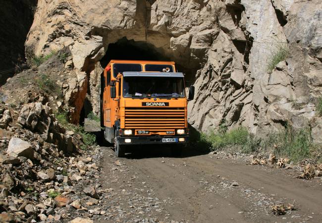 South American Overland truck driving through a tunnel