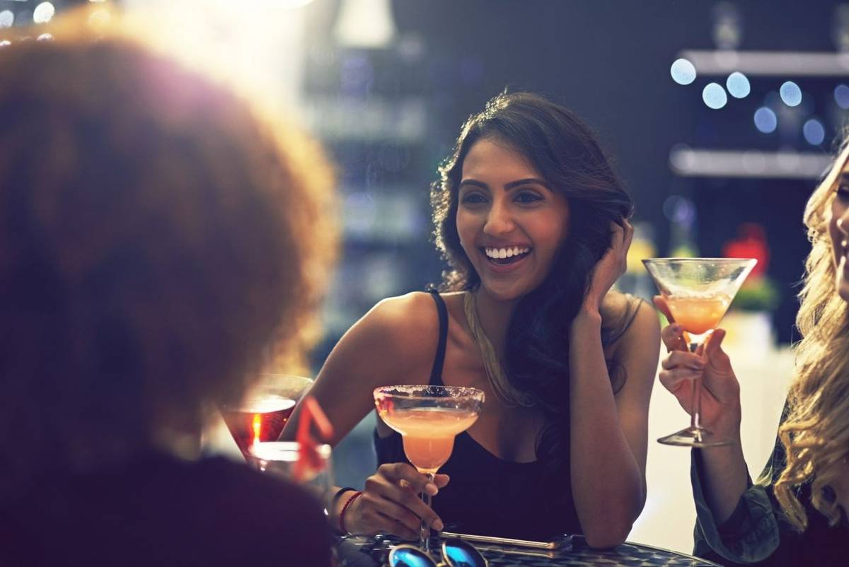Shot of a group of friends relaxing with cocktails in a nightclub.