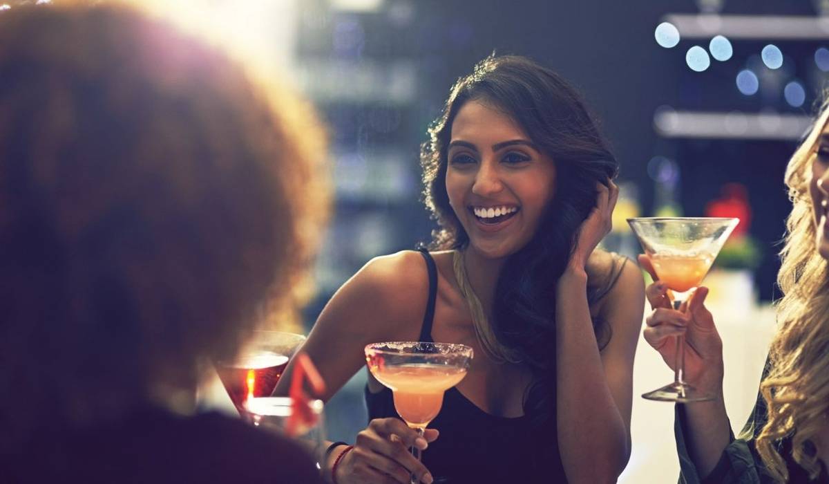 Shot of a group of friends relaxing with cocktails in a nightclub.