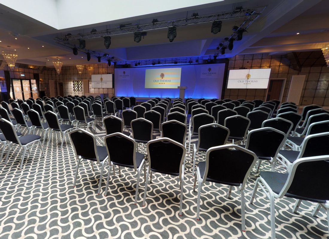 Large conference being held with lots of chairs