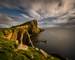 Neist Point cliffs and lighthouse in sunset light, Isle of Skye, Scotland
