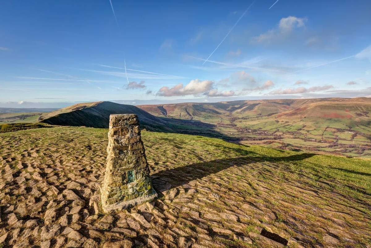 A Triangulation station, or Trig Point at the top of Mam Tor in the Peak District, Derbyshire, UK