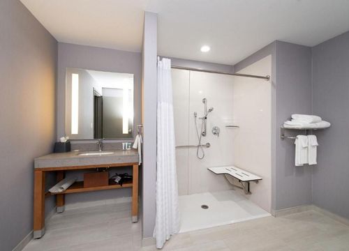 Hyatt Place DallasRockwall bedroom bathroom.jpg
