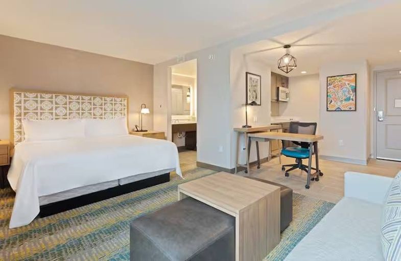 Homewood Suites by Hilton St. Augustine San Sebastian guest room + living area.jpg