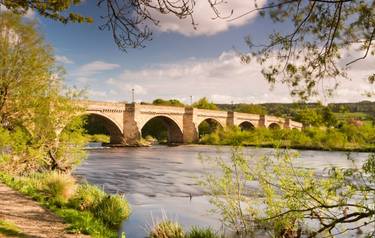 Bridge over the river Tyne leading into Corbidge village on a sunny spring day