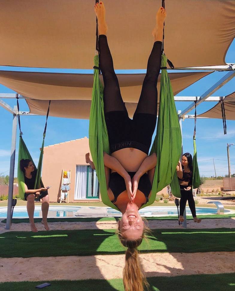 Alamos Yoga Retreat - Aerial Yoga hanging in upside down in hammock.jpg