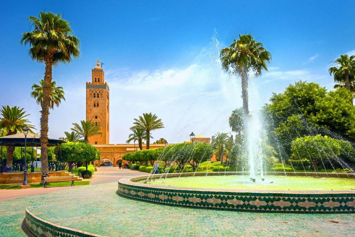 Scenic view from garden with fountain of minaret of Koutoubia Mosque in Marrakech. Morocco, North Africa