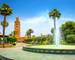 Scenic view from garden with fountain of minaret of Koutoubia Mosque in Marrakech. Morocco, North Africa