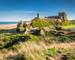 Bamburgh Castle viewed from an elevated hillock, on the Northumberland coastline