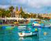 Marsaxlokk, Malta - Traditional colorful maltese Luzzu fisherboat at the old village of Marsaxlokk with turquoise sea water …