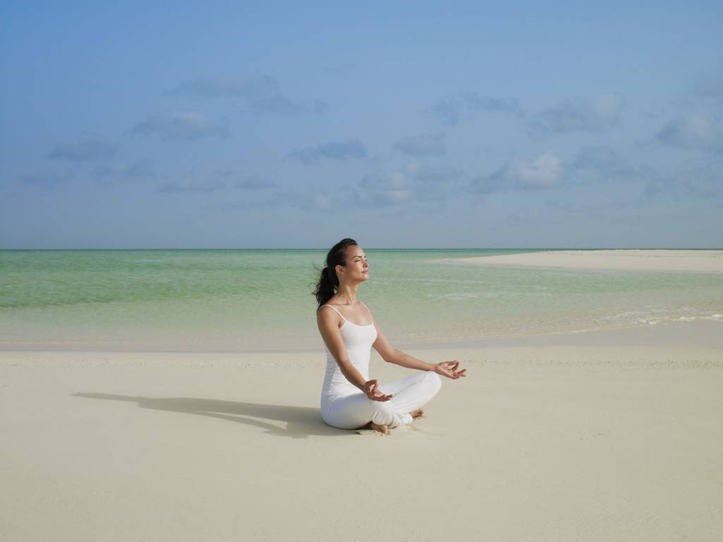 Yoga on the beach at Parrot Cay