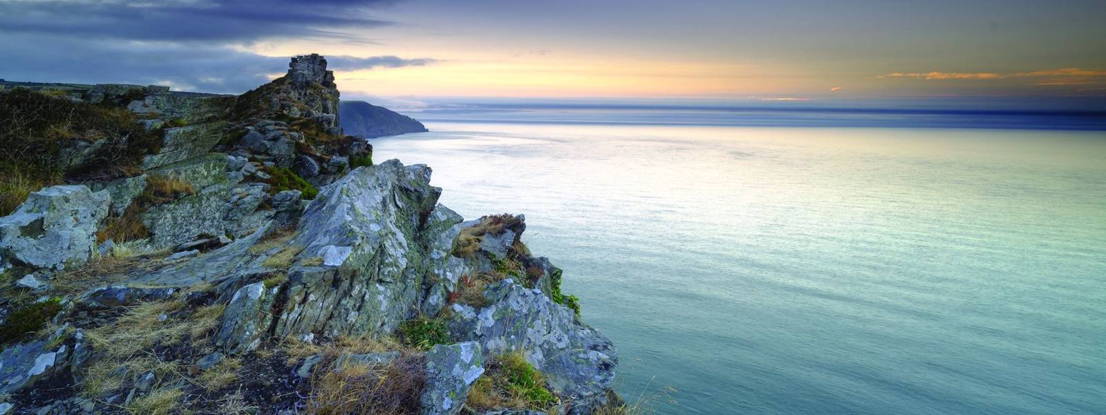 Summer sunset over the Valley of Rocks, near Lynton in the Exmoor National Park, Devon, UK