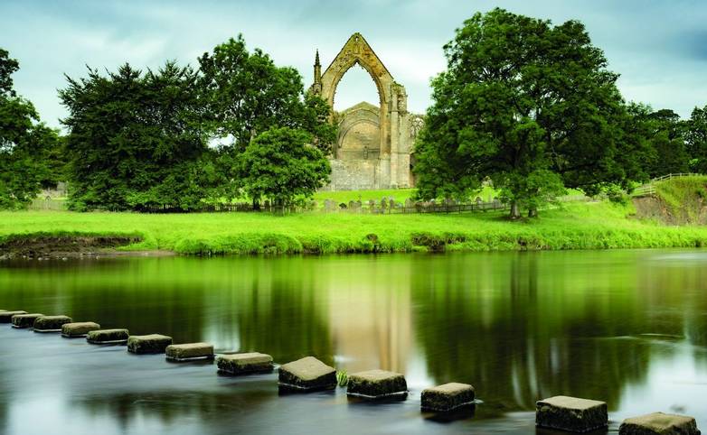 Stepping stones across the river Wharf in front of Bolton Abbey.