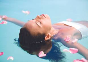 A woman floating in a pool