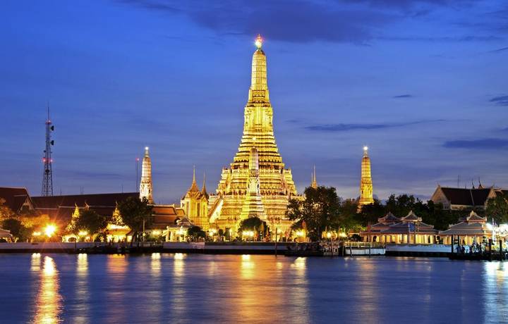 Twilight time of Wat Arun across Chao Phraya River during sunset in Bangkok, Thailand Twilight time of Wat Arun across Chao Phraya River during sunset in Bangkok, Thailand