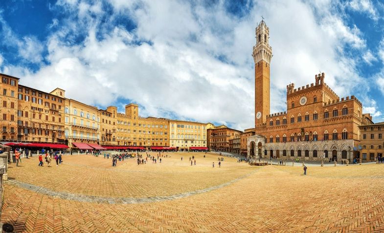 Panorama of Piazza del Campo (Campo square), Palazzo Pubblico and Torre del Mangia (Mangia tower) in Siena, Tuscany, Italy.