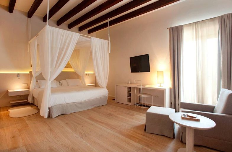 Fontsanta Hotel Thermal Spa & Wellness bedroom with canopy.jpg