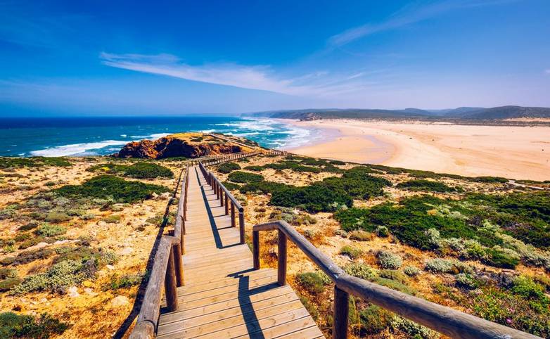 Praia da Bordeira and boardwalks forming part of the trail of tides or Pontal da Carrapateira walk in Portugal. Amazing view…