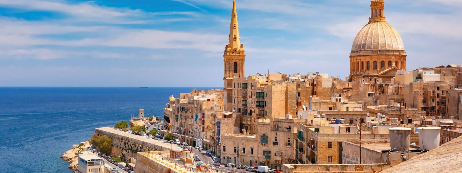 View from above of roofs and church of Our Lady of Mount Carmel and St. Paul's Anglican Pro-Cathedral, Valletta, Capital cit…
